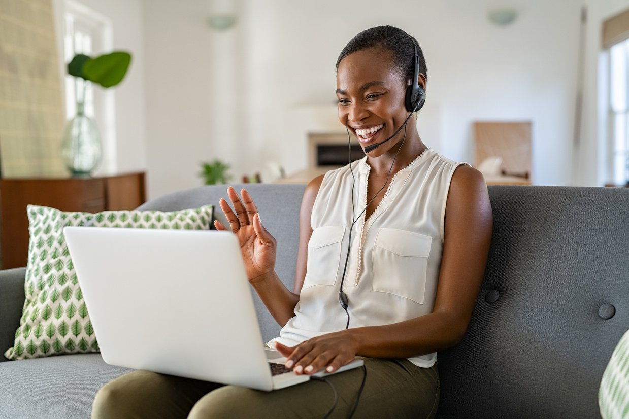 Woman Using Laptop for Video Call to Work